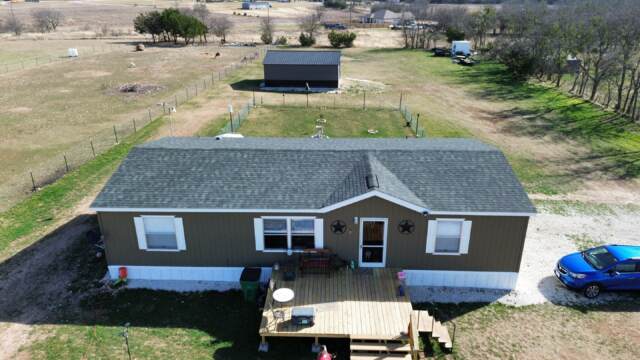 Front of home showing the new 30 year IKO Dynasty Class 3 shingles in Emerald Green