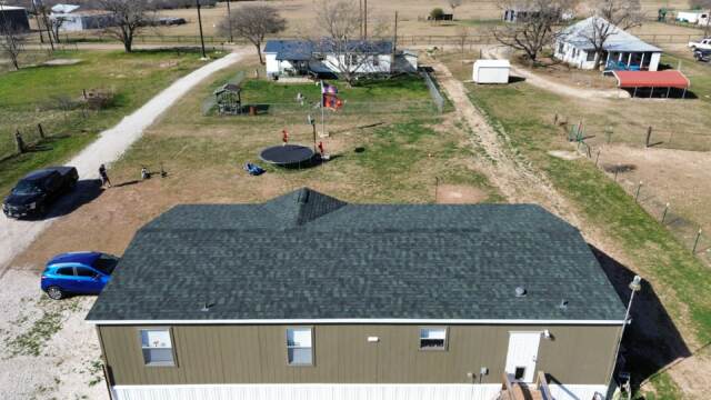 Rear of home showing the new 30 year IKO Dynasty Class 3 shingles in Emerald Green