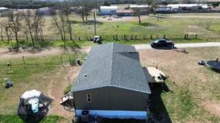 Left side of home showing the new 30 year IKO Dynasty Class 3 shingles in Emerald Green