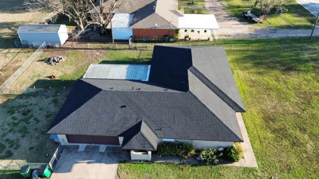 Left side of home showing the new 30 year IKO Dynasty Class 3 Architectural Shingles in Matte Black