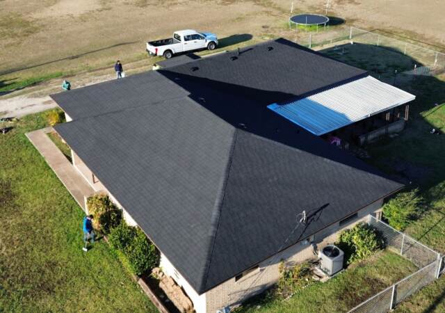 Front right of home showing the new 30 year IKO Dynasty Class 3 Architectural Shingles in Matte Black