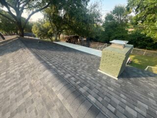 View of the rear slope of the roof showing the new 30 year Class 3 Architectural shingles. Shingles are IKO Dynasty in Granite Black