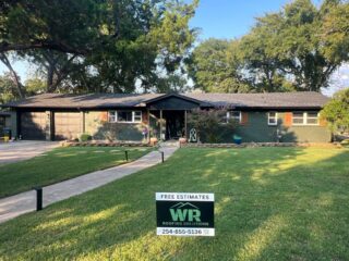 View of the front of the home showing the new 30 year Class 3 Architectural shingles. Shingles are IKO Dynasty in Granite Black