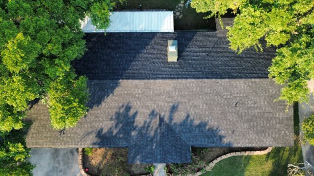 Aerial view directly overhead of home showing the new 30 year Class 3 Architectural shingles. Shingles are IKO Dynasty in Granite Black