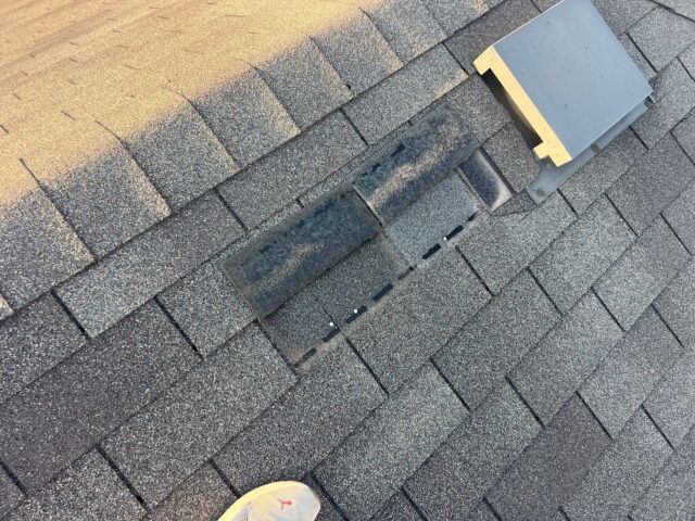 photo of wind damaged shingles 