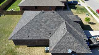 Aerial view of the left side of the roof showing new IKO Dynasty shingles in Driftshake
