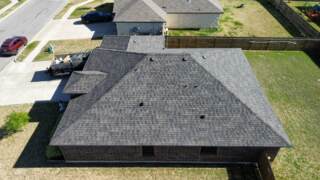 Aerial view of the right side of the roof showing new IKO Dynasty shingles in Driftshake