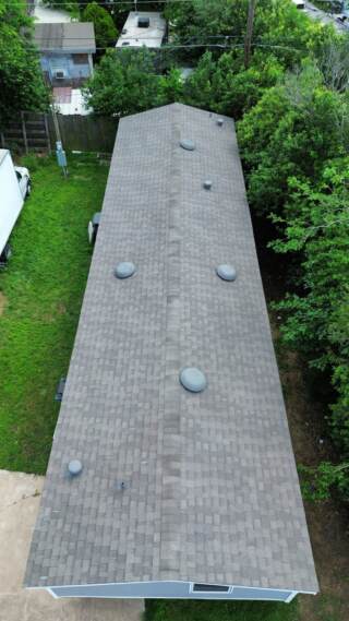 Aerial view of roof from the right side showing new IKO Cambridge shingles in Weatherwood
