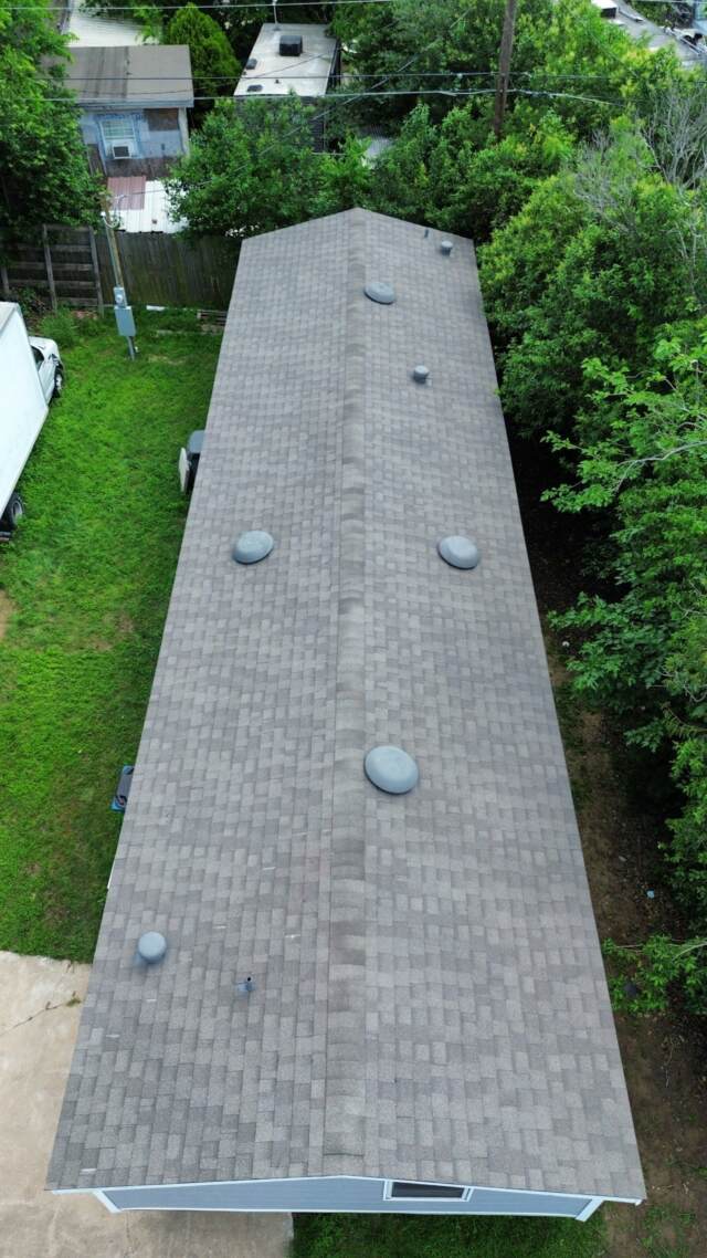 Aerial view of roof from the right side showing new IKO Cambridge shingles in Weatherwood