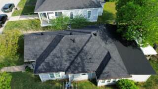 Aerial view of the right side of the roof showing new IKO Cambridge shingles in Dual Black