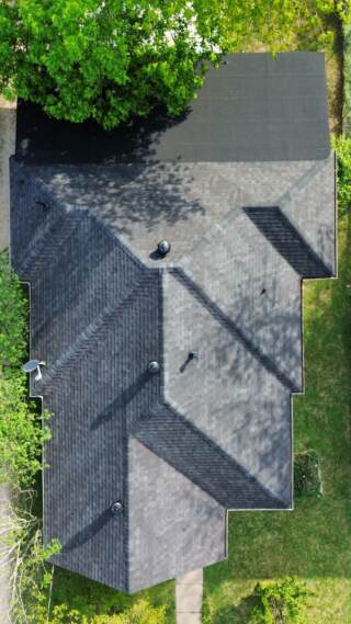 Aerial view from directly overhead of the roof showing new IKO Cambridge shingles in Dual Black