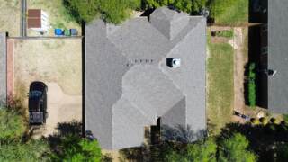 Aerial view of the roof from directly overhead showing new IKO Cambridge shingles in Weatherwood
