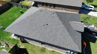 Aerial view of the left side of the house showing new IKO Cambridge shingles in Driftwood