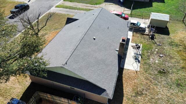 Aerial view of left side of roof showing new IKO Cambridge shingles in Weatherwood