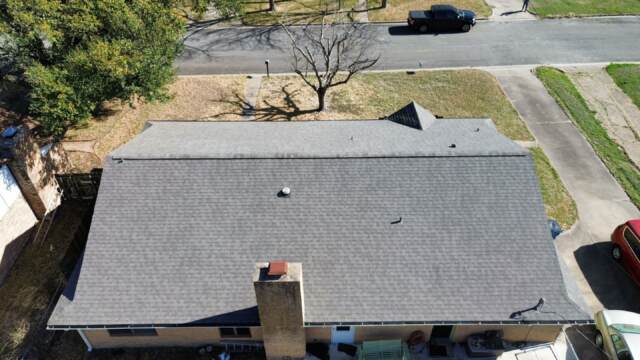 Aerial view of rear slope of roof showing new IKO Cambridge shingles in Weatherwood
