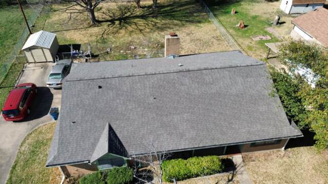 Aerial view of front slope of roof showing new IKO Cambridge shingles in Weatherwood