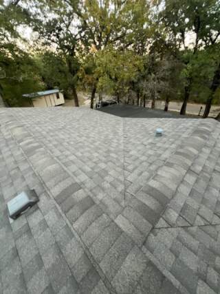 View of the front slope of the roof with new 30 year Architectural shingles. Shingles are IKO Cambridge in Weatherwood