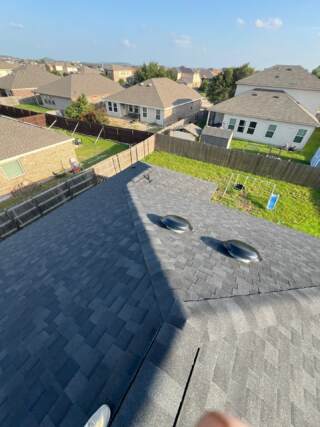 View from the roof of the right rear with new 30 year Architectural shingles. Shingles are IKO Cambridge in Dual Black