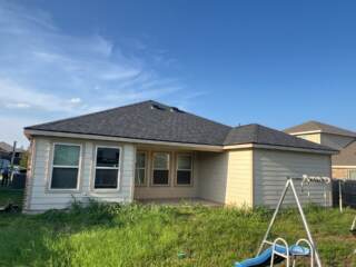 View of the back of the home with new 30 year Architectural shingles. Shingles are IKO Cambridge in Dual Black