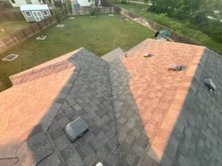 View of the rear left of the roof with new 30 year Architectural shingles. Shingles are IKO Cambridge in Weatherwood