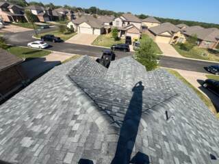 View of the front of the roof showing the new 30 year Class 4 Architectural shingles. Shingles are IKO Nordic in Castle Grey