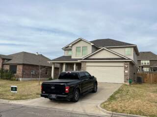 View of the front of the home with new 30 year Class 3 Architectural shingles. Shingles are IKO Dynasty in Driftshake