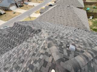 View from the roof of the left slope with new 30 year Class 3 Architectural shingles. Shingles are IKO Dynasty in Driftshake