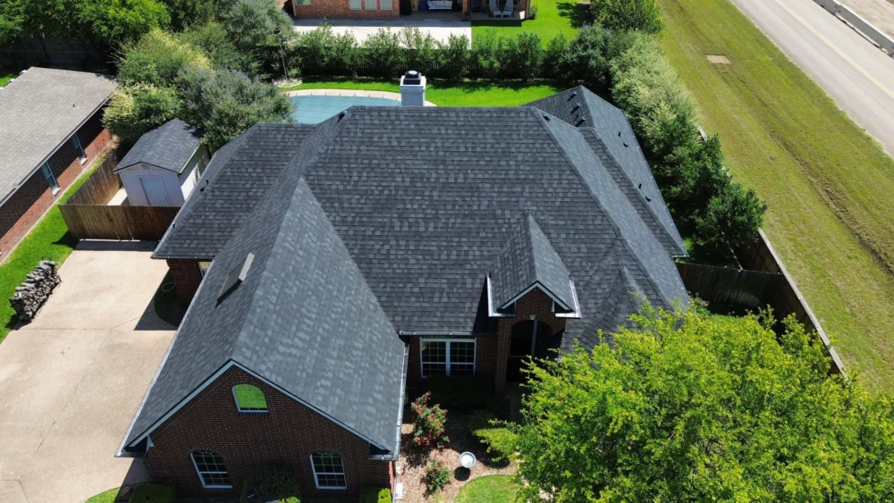 Front view of the roof showing new architectural shingles by IKO in Granite Black