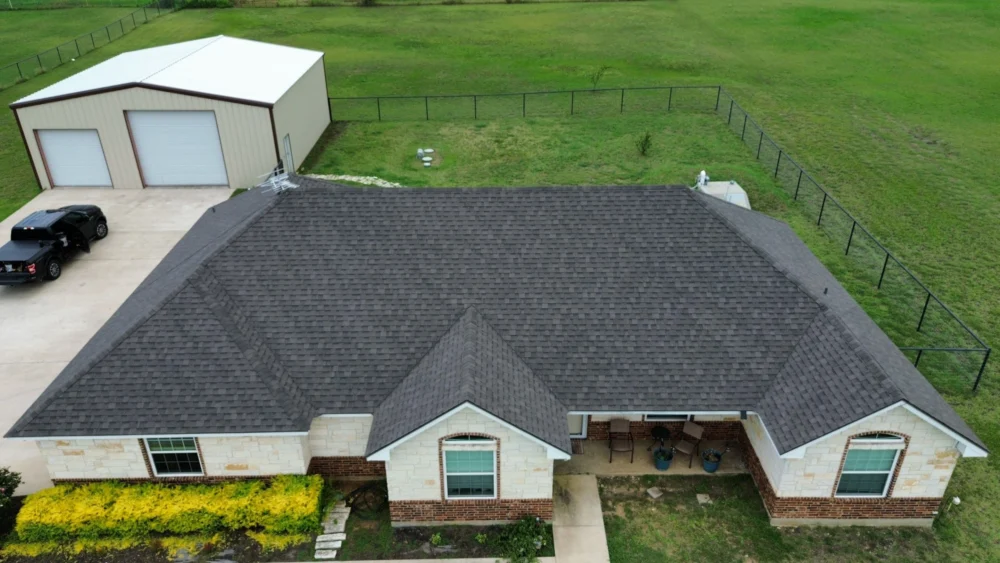 Front view of the roof showing new IKO Class 3 shingles in Driftwood