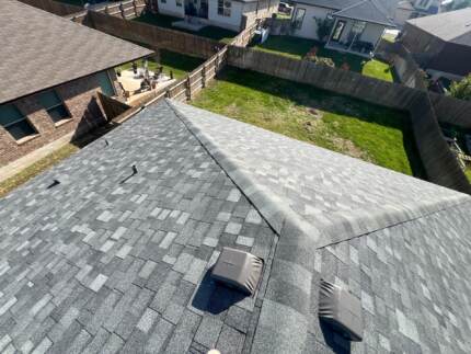 New roof, rear view- IKO Nordic Class 4 Impact Resistant shingle. color: Castle Grey